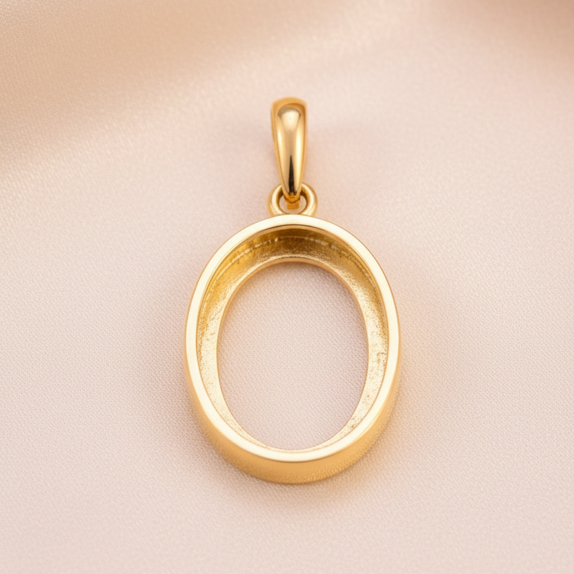Gold oval memorial pendant – hollow back view showing cabochon mount