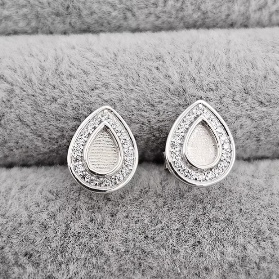 Silver 925 pear CZ halo stud earrings close up front view — blank silver