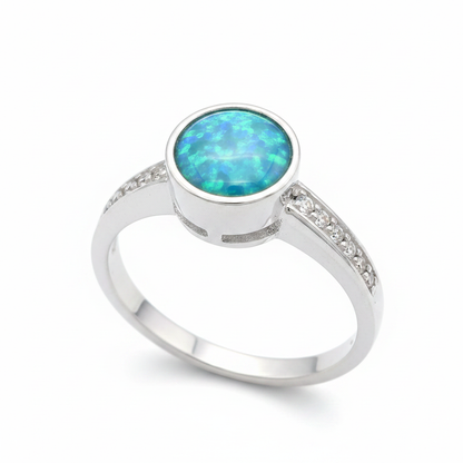 Multi gem round 6mm CZ 925 silver ring with blue teal opal resin side angle view white background