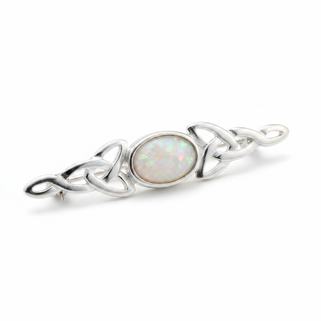 Silver 925 dainty Celtic trinity knot lapel brooch with white pearl opal resin in 7x5mm central setting on white background