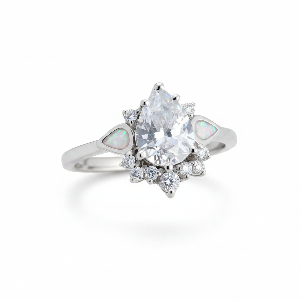 Silver 925 CZ dewdrop cluster ring with white pearl opal resin in tapered shoulder channels on white background