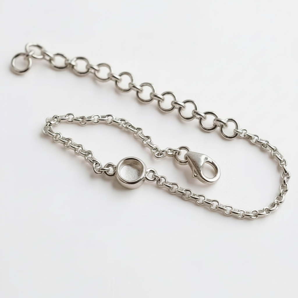 Mini round charm silver bracelet with white pearl opal resin in round bezel, white background