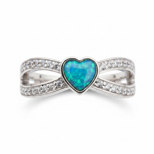 Split heart CZ 925 silver ring with blue teal opal resin in 6mm heart centre on white background
