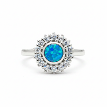 925 sterling silver round CZ cluster halo memorial ring with blue teal opal flakes in flat round resin setting on white background
