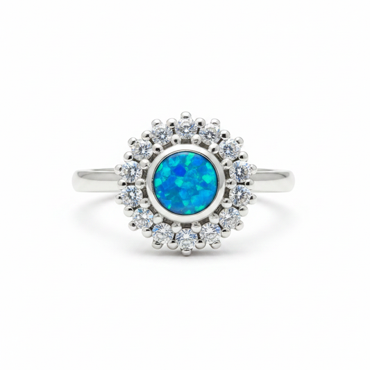 925 sterling silver round CZ cluster halo memorial ring with blue teal opal flakes in flat round resin setting on white background