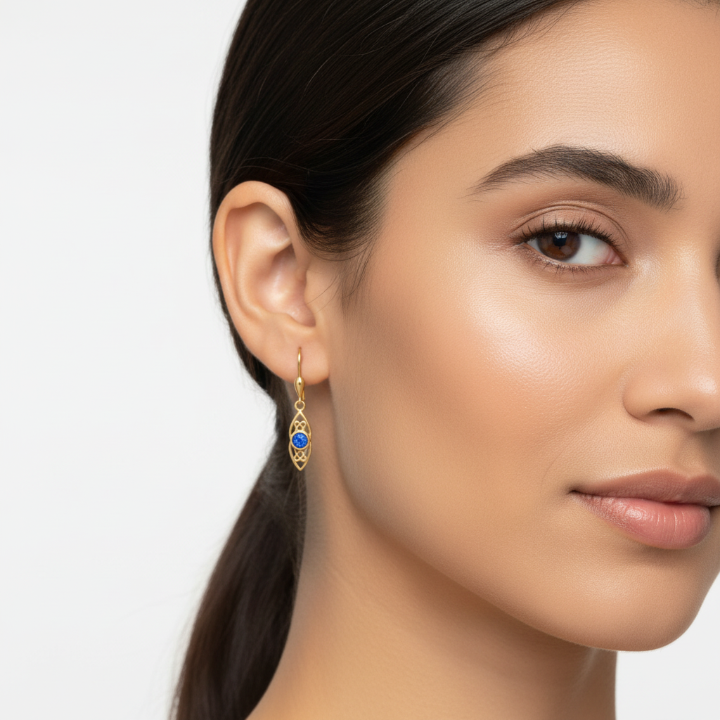 Model wearing 9ct gold Celtic knotwork drop earrings showing true dainty scale – 17x7mm drop at realistic size on ear