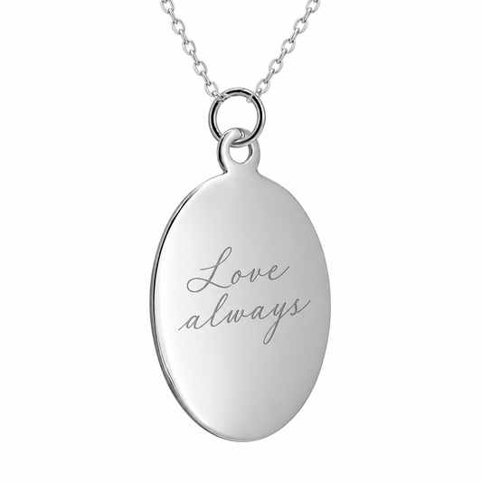 Illustrative handwritten engraving on plain oval 925 Sterling Silver pendant with included chain, white background
