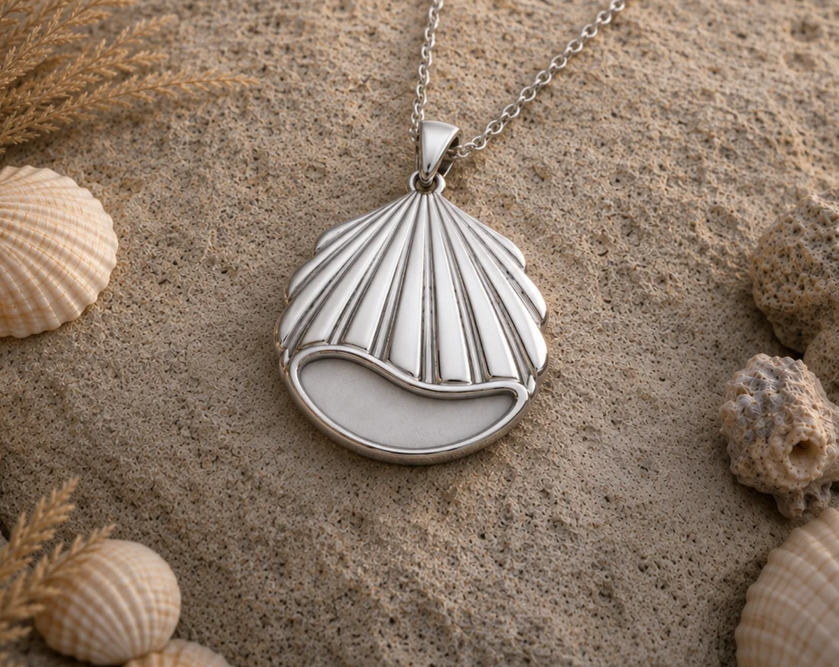 Seashell memorial pendant in stainless steel held in hand
