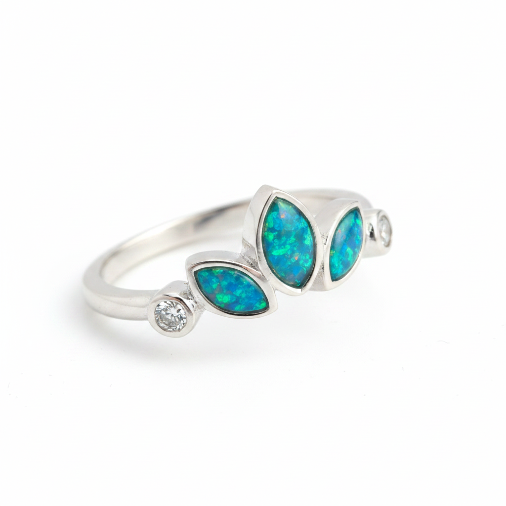Trilogy marquise bezel 925 silver ring with blue teal opal resin angled view on white background