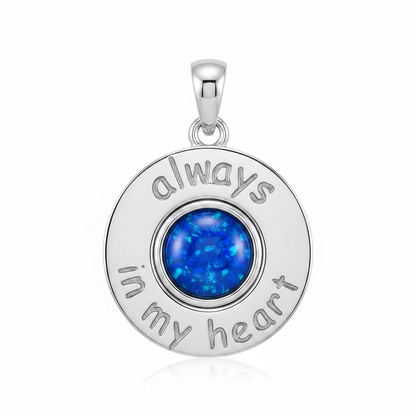 Silver 925 Always In My Heart memorial pendant with blue opal flakes, white background