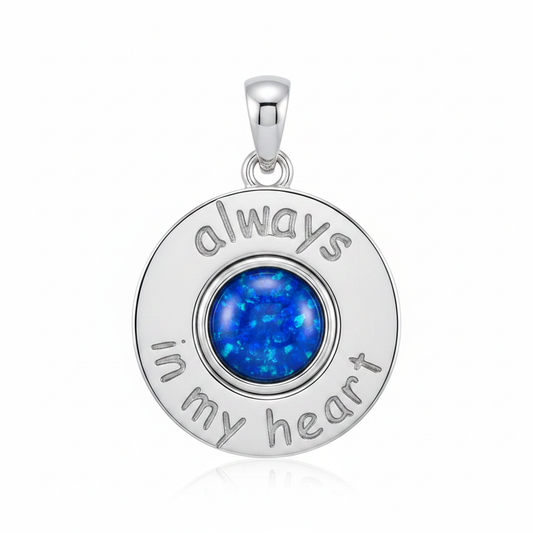 Silver 925 Always In My Heart memorial pendant with blue opal flakes, white background