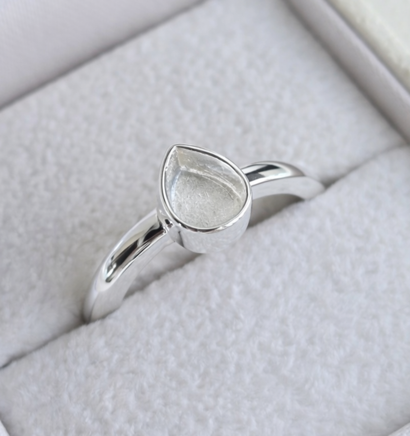 925 sterling silver plain pear memorial ring close up — showing pear bezel setting detail on smooth polished band