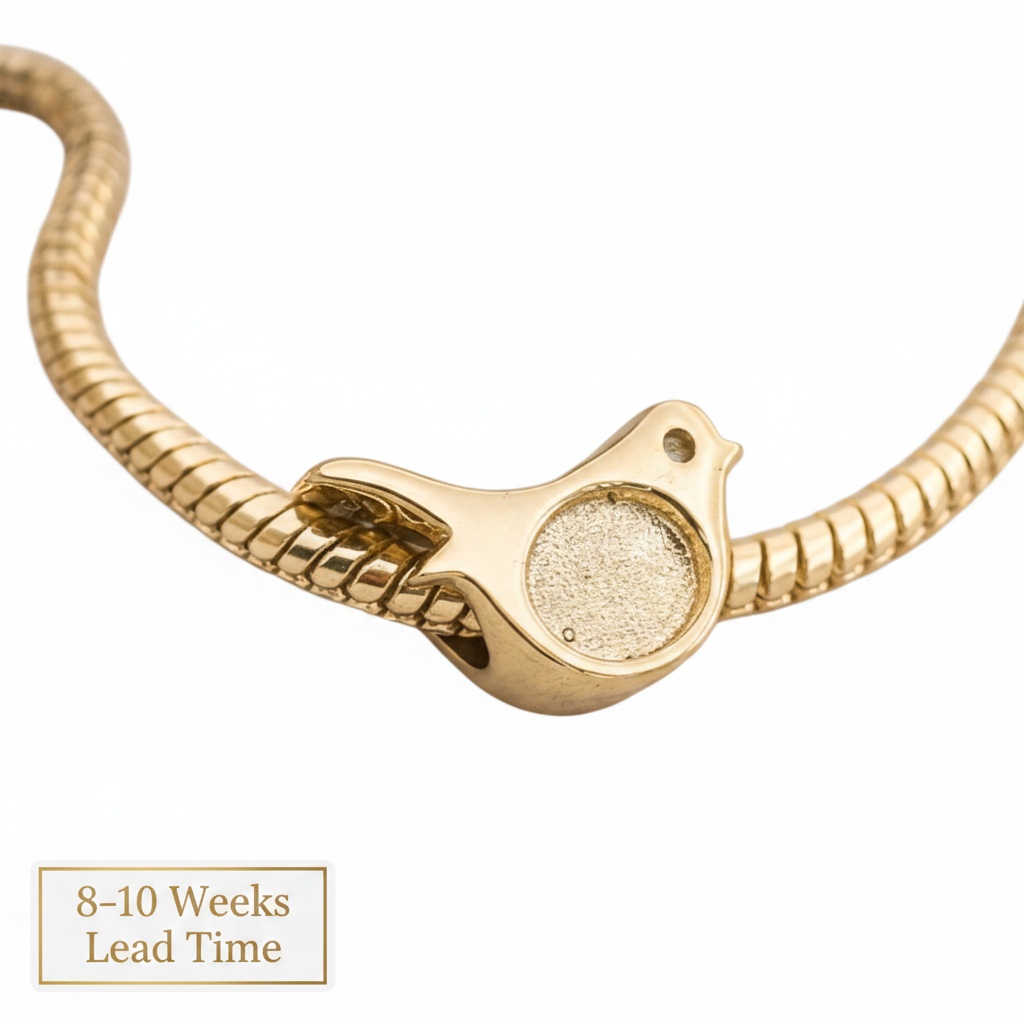 9ct Gold Robin Bead Charm — blank yellow gold on bracelet, white background, 8-10 weeks lead time sticker