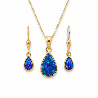 9ct gold teardrop memorial jewellery set with deep blue iridescent opal flakes – pendant earrings and chain flat-lay white background