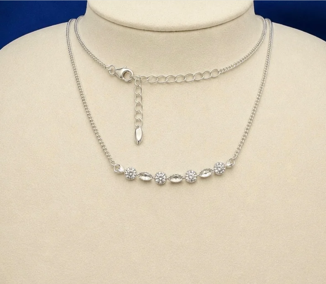 925 sterling silver CZ marquise bar necklace on jewellery display showing curved bar with alternating CZ rounds and marquise bezels on curb chain with adjustable extension