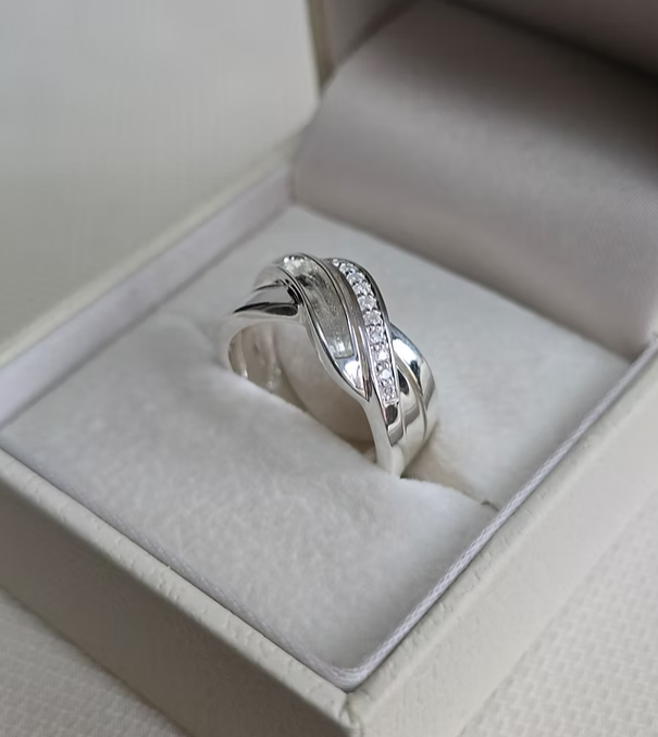 925 sterling silver double crossover band memorial ring in white gift box showing CZ and resin channel wave bands