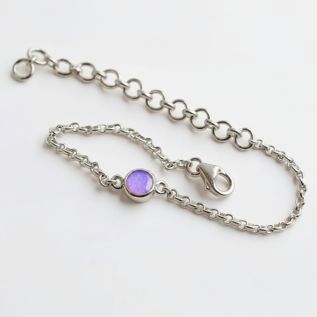 Mini round charm silver bracelet with lavender purple opal resin in round bezel, white background
