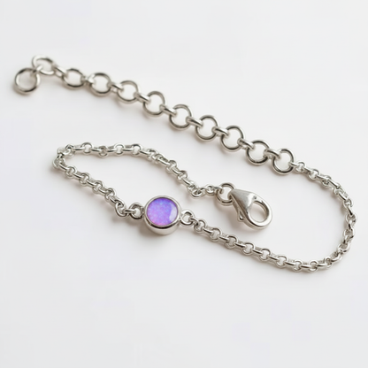 Mini round charm silver bracelet with lavender purple opal resin in round bezel, white background