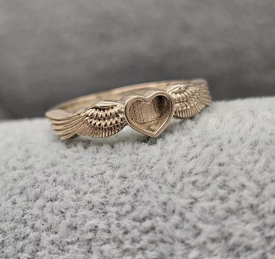 9ct gold heart angel wing ring angled side view showing wing detail and heart bezel depth