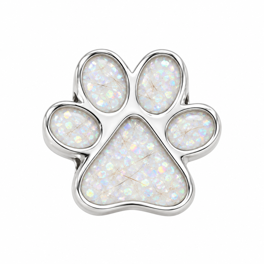 Illustrative paw print memorial bead charm with pearl white opal flakes and pet fur