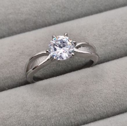 Stainless steel CZ solitaire memorial ring front view showing 6mm round brilliant cubic zirconia in six-prong setting on split cathedral shank