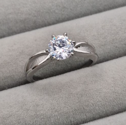 Stainless steel CZ solitaire memorial ring front view showing 6mm round brilliant cubic zirconia in six-prong setting on split cathedral shank