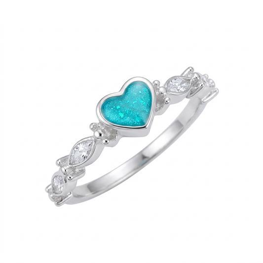 Illustrative dainty silver heart and almond CZ memorial ring with turquoise opal flakes