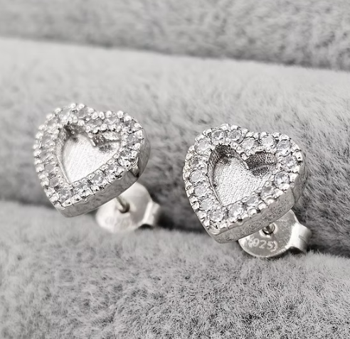 Silver 925 heart CZ halo stud earrings on grey fabric — blank silver