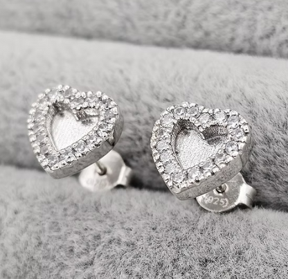 Silver 925 heart CZ halo stud earrings on grey fabric — blank silver