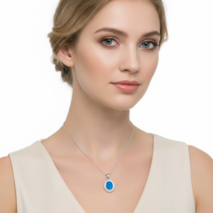 Model wearing silver 925 oval halo CZ memorial pendant at true 16x14mm scale