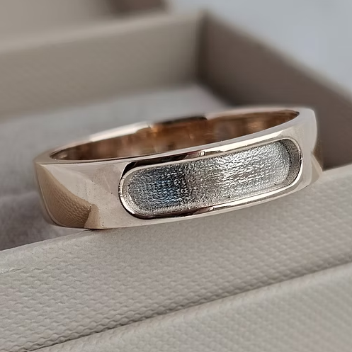9ct rose gold 6mm rounded front face channel band ring blank, angled view showing oval channel and polished gold band