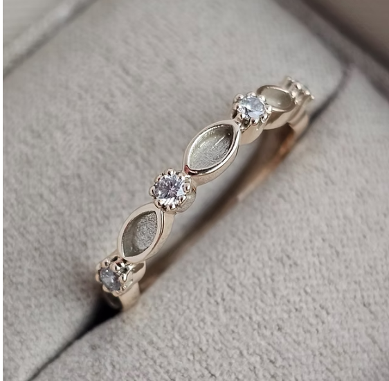9ct yellow gold half marquise CZ band ring top view showing alternating marquise bezels and CZ prong stones