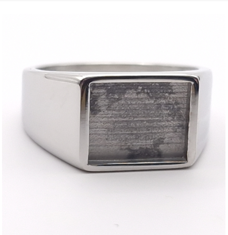 Men's stainless steel signet memorial ring front view showing large rectangular resin bezel setting on wide polished band