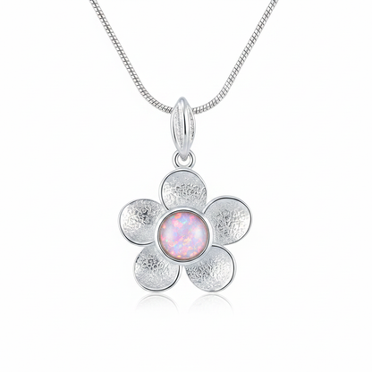 Silver 925 daisy flower memorial pendant with pink opal flakes, white background
