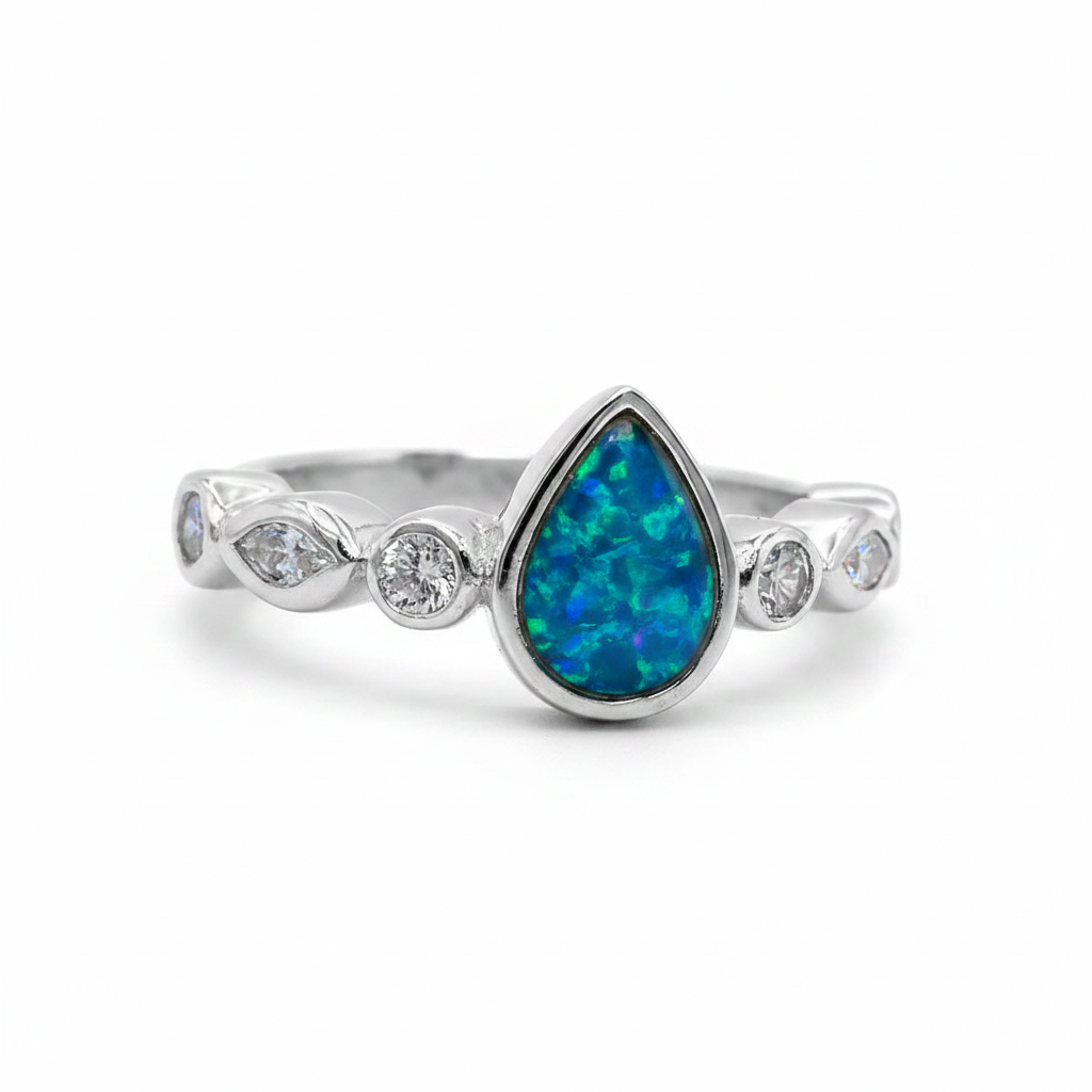 Pear marquise shank CZ 925 silver ring with blue teal opal resin in pear centre setting on white background