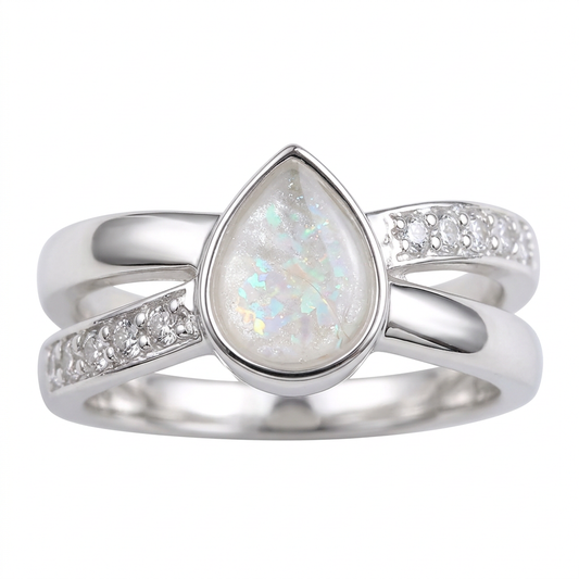 Illustrative Pear Infinity silver memorial ring with pearl white opal flakes