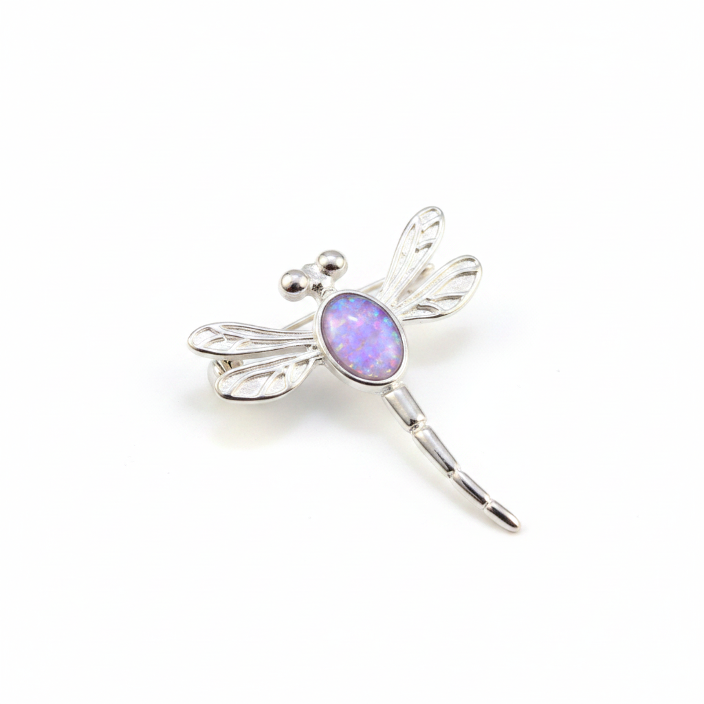 Silver 925 filigree dragonfly brooch with lavender purple opal resin in 7x5mm central setting on white background