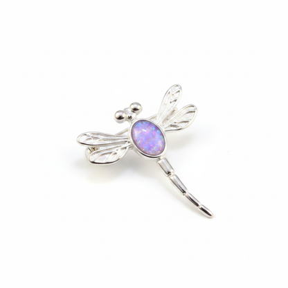 Silver 925 filigree dragonfly brooch with lavender purple opal resin in 7x5mm central setting on white background