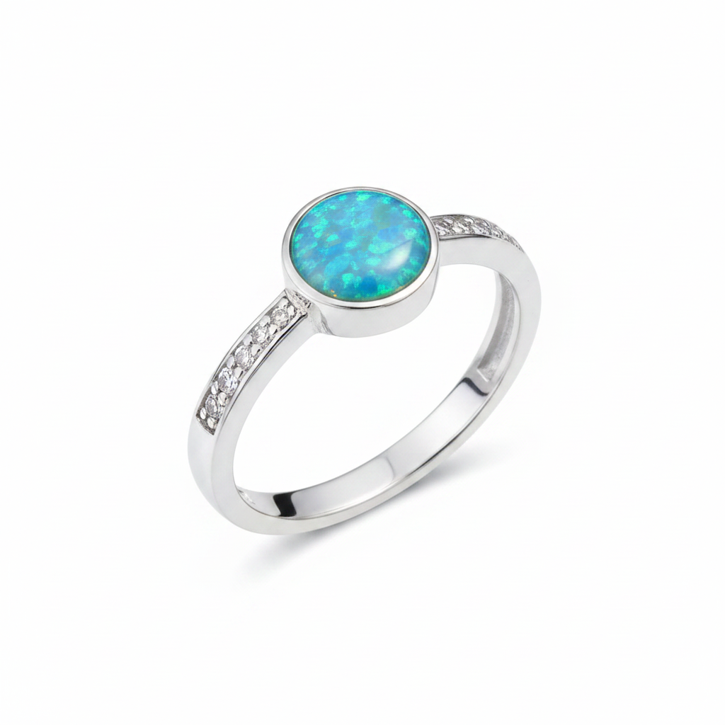 Silver 925 full shank CZ ring with blue teal opal resin in 6mm central setting on white background