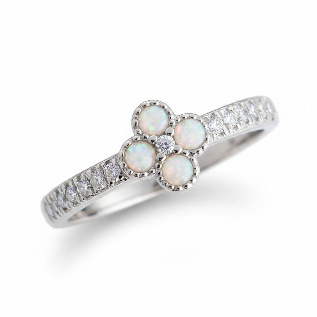 Petite clover 925 silver CZ ring with white pearl opal resin in four milgrain bezels on white background