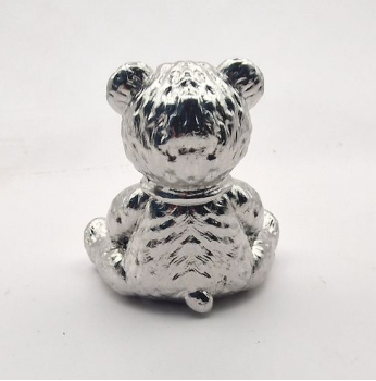 Chrome mirror-polished stainless steel teddy bear memorial ornament rear view showing highly polished finish