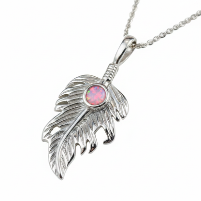 Silver 925 feather leaf memorial pendant with pink opal flakes, white background