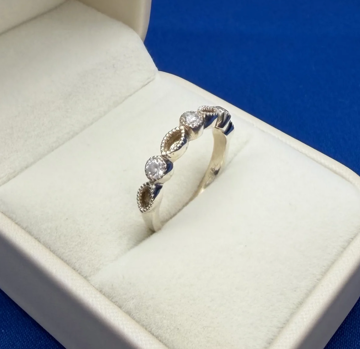925 sterling silver CZ marquise half band ring side view showing depth of milgrain bezels and band profile