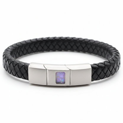 Black leather memorial bracelet with lavender purple opal resin in stainless steel clasp recess on white background
