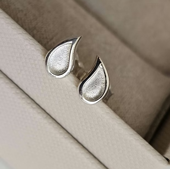 Silver 925 milk drop teardrop stud earrings close up — blank silver