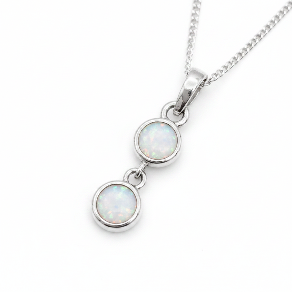 Two Round Bezel 925 Silver Memorial Pendant with white pearl opal resin in both bezels — white background