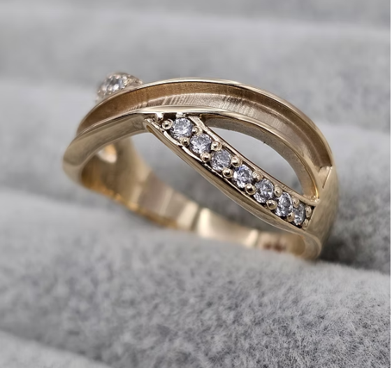 9ct yellow gold infinity CZ crossover ring angled view showing full band depth