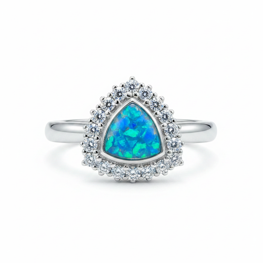 925 sterling silver trillion cut CZ halo memorial ring with blue teal opal flakes in flat triangular resin setting on white background