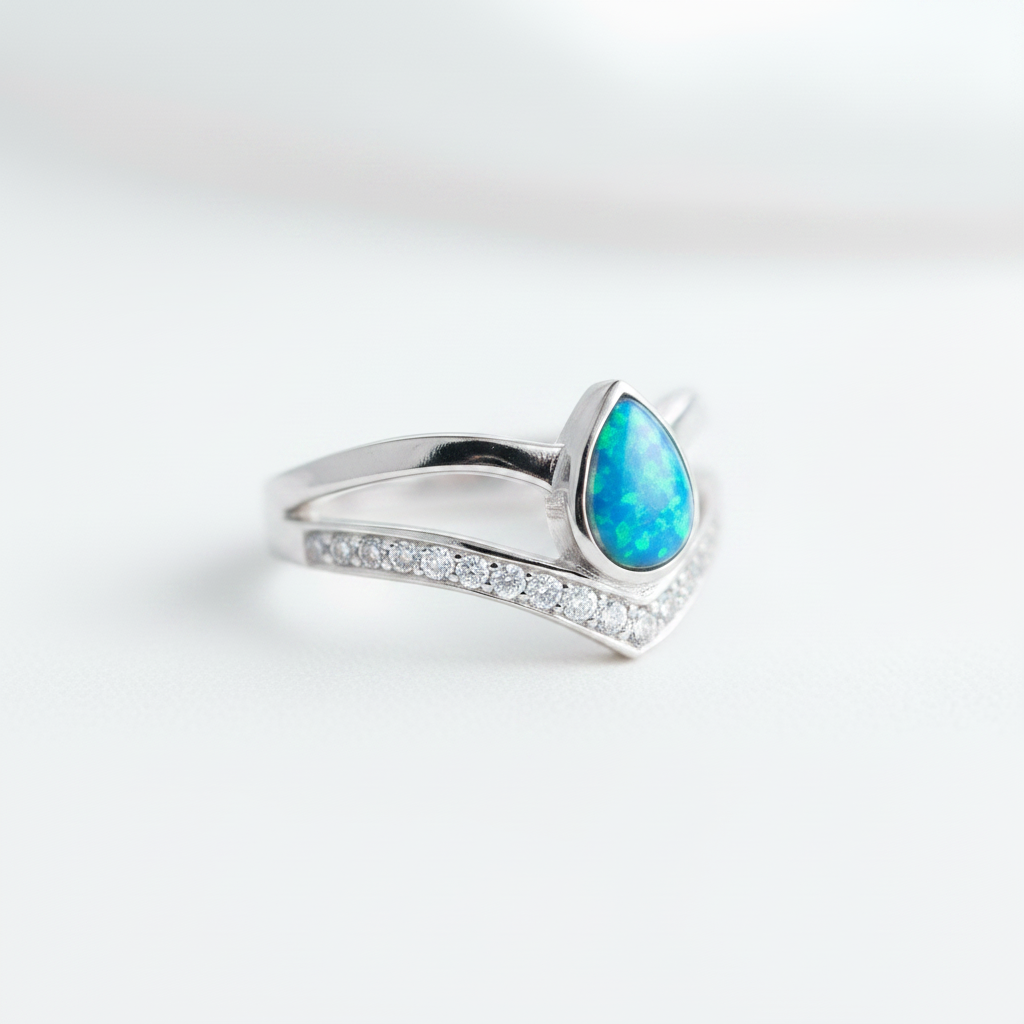 925 sterling silver pear wishbone memorial ring with blue teal opal flakes in pear bezel