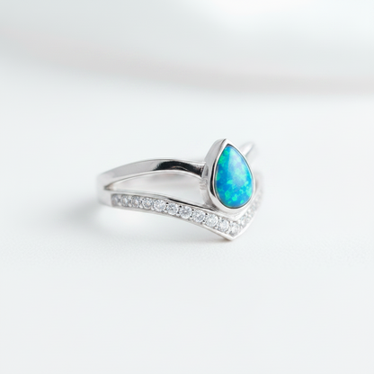 925 sterling silver pear wishbone memorial ring with blue teal opal flakes in pear bezel